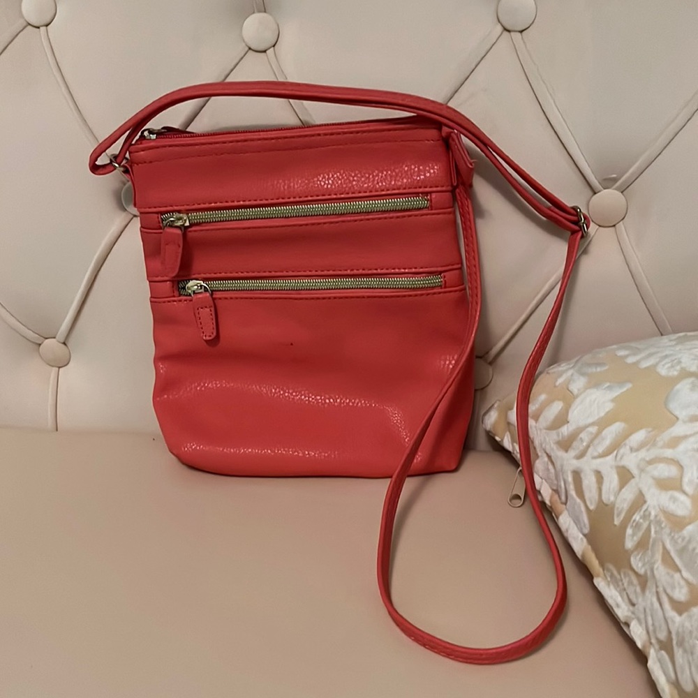 Peach, fake, leather purse with gold zippers and many compartments